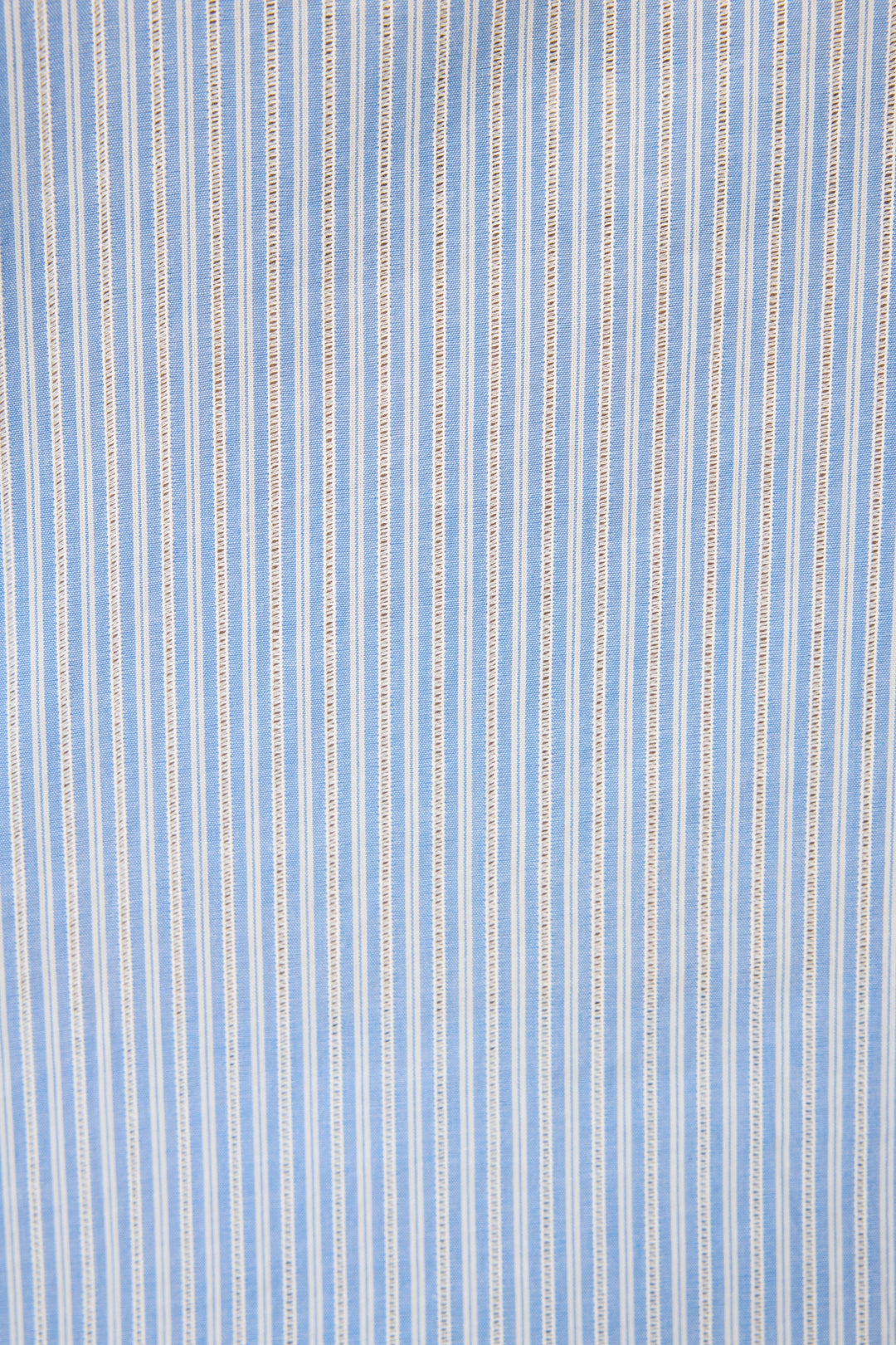 Women's blue & white striped cotton shirt with 3/4 ruffle sleeve. Collar & button-front. Waist length in lightweight woven.