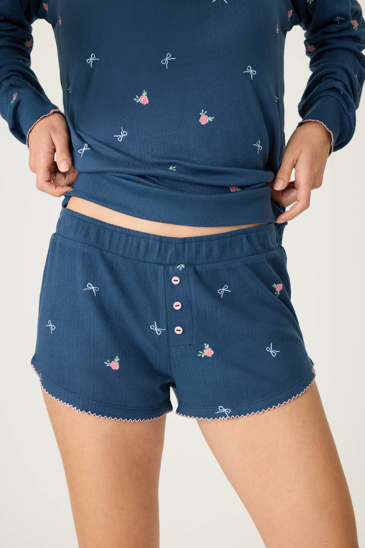 Navy blue with floral sleep short for women. Curved hem with picot edging.