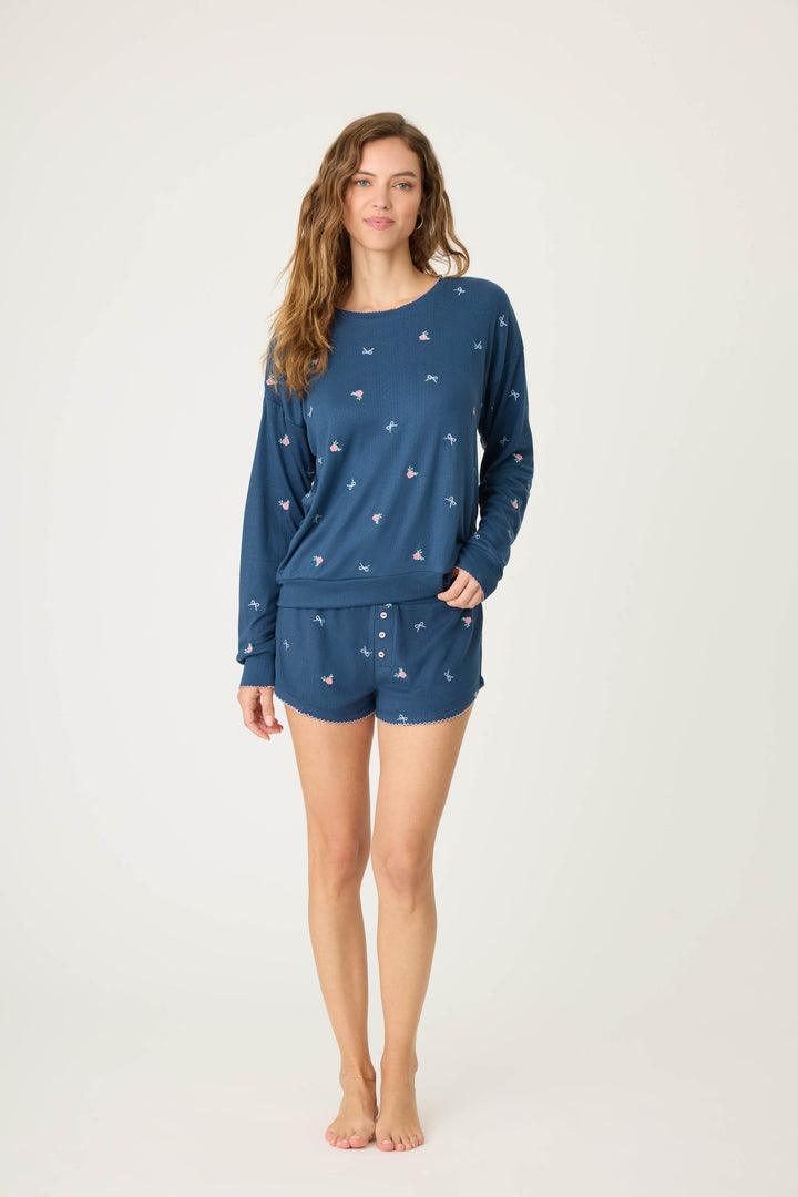 Navy blue with floral sleep short for women. Curved hem with picot edging.