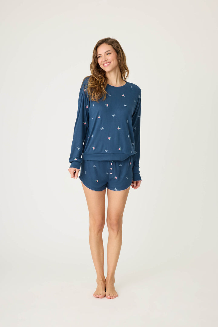 Navy blue with floral sleep short for women. Curved hem with picot edging.