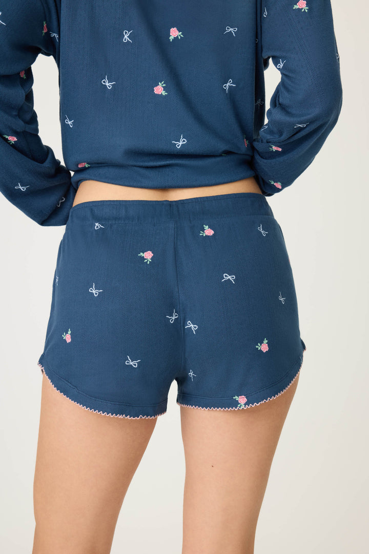 Navy blue with floral sleep short for women. Curved hem with picot edging.