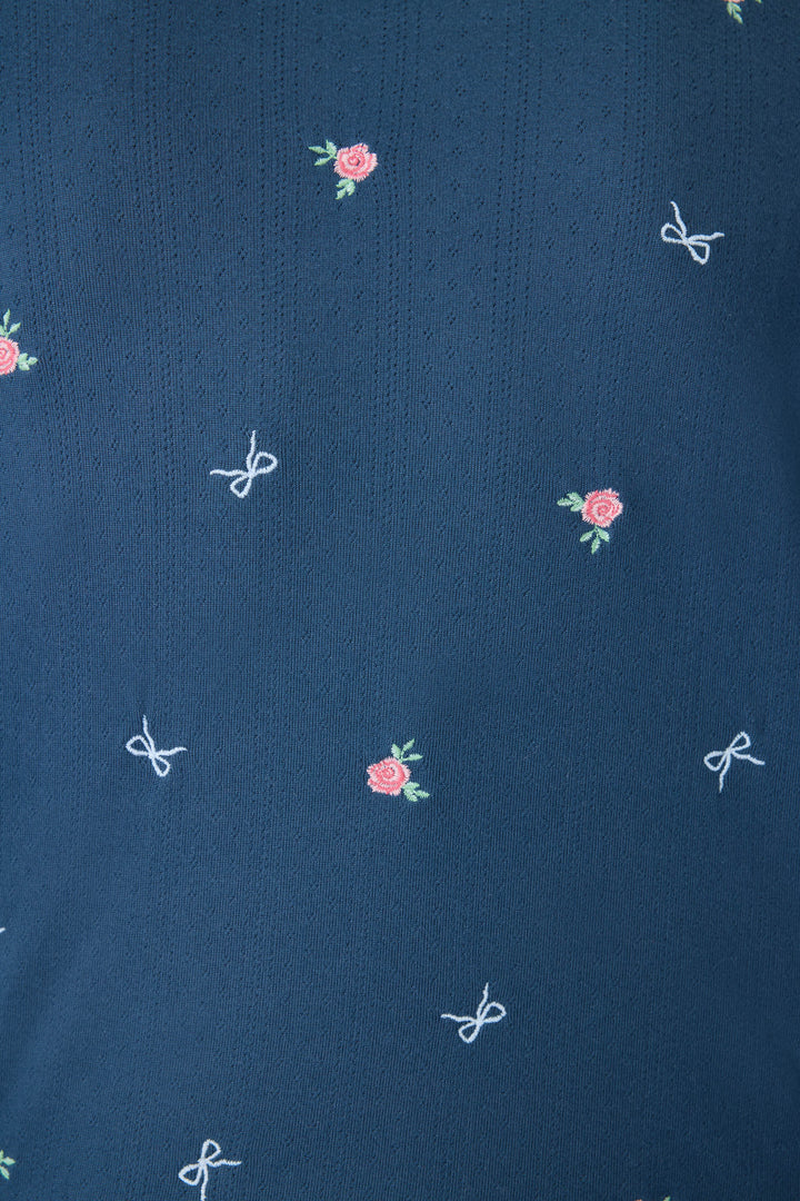 Navy blue with floral sleep short for women. Curved hem with picot edging.
