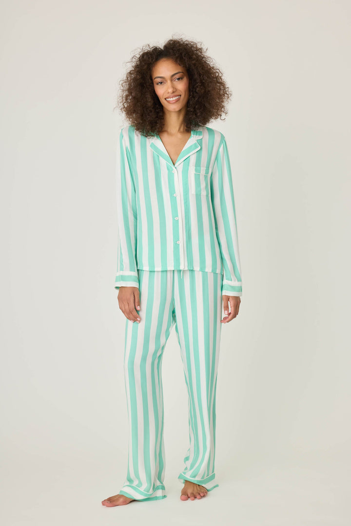 Women's pajama pant in ivory-green stripe print in woven rayon sateen. Tie-waist and contrast striped cuffs.
