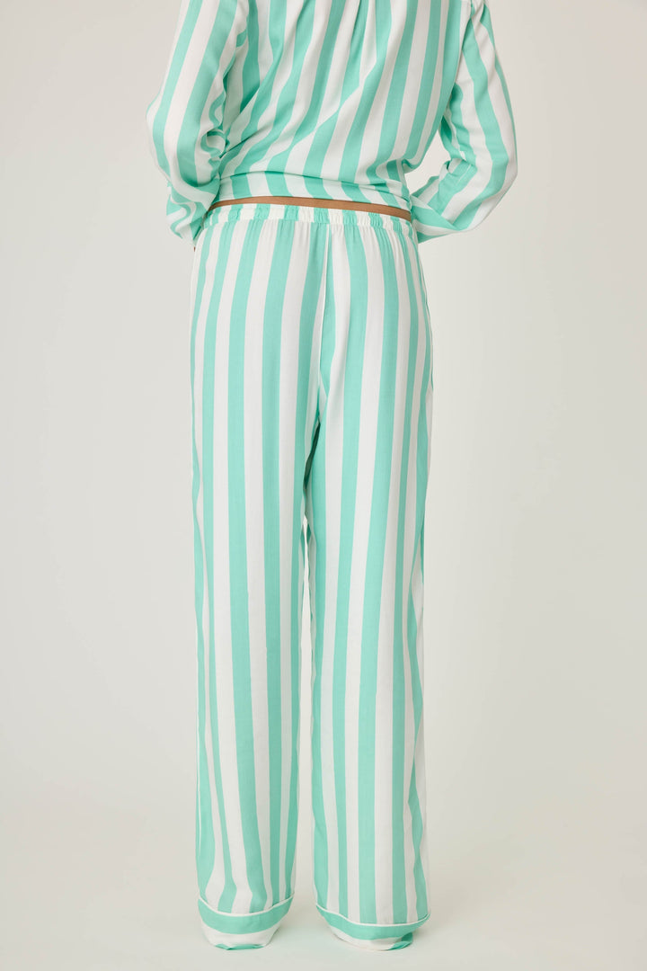 Women's pajama pant in ivory-green stripe print in woven rayon sateen. Tie-waist and contrast striped cuffs.
