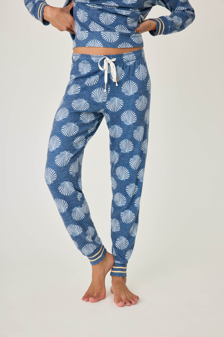 Navy shell-printed jogger pant for women. Tie waist with gold striped ankle cuffs.