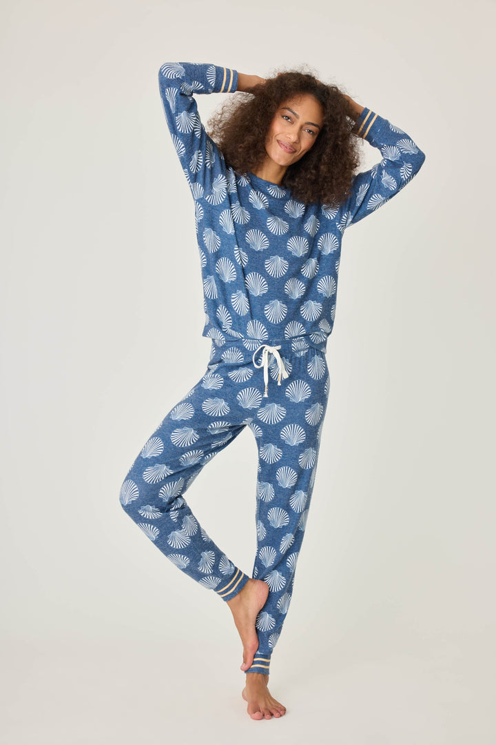 Navy shell-printed jogger pant for women. Tie waist with gold striped ankle cuffs.