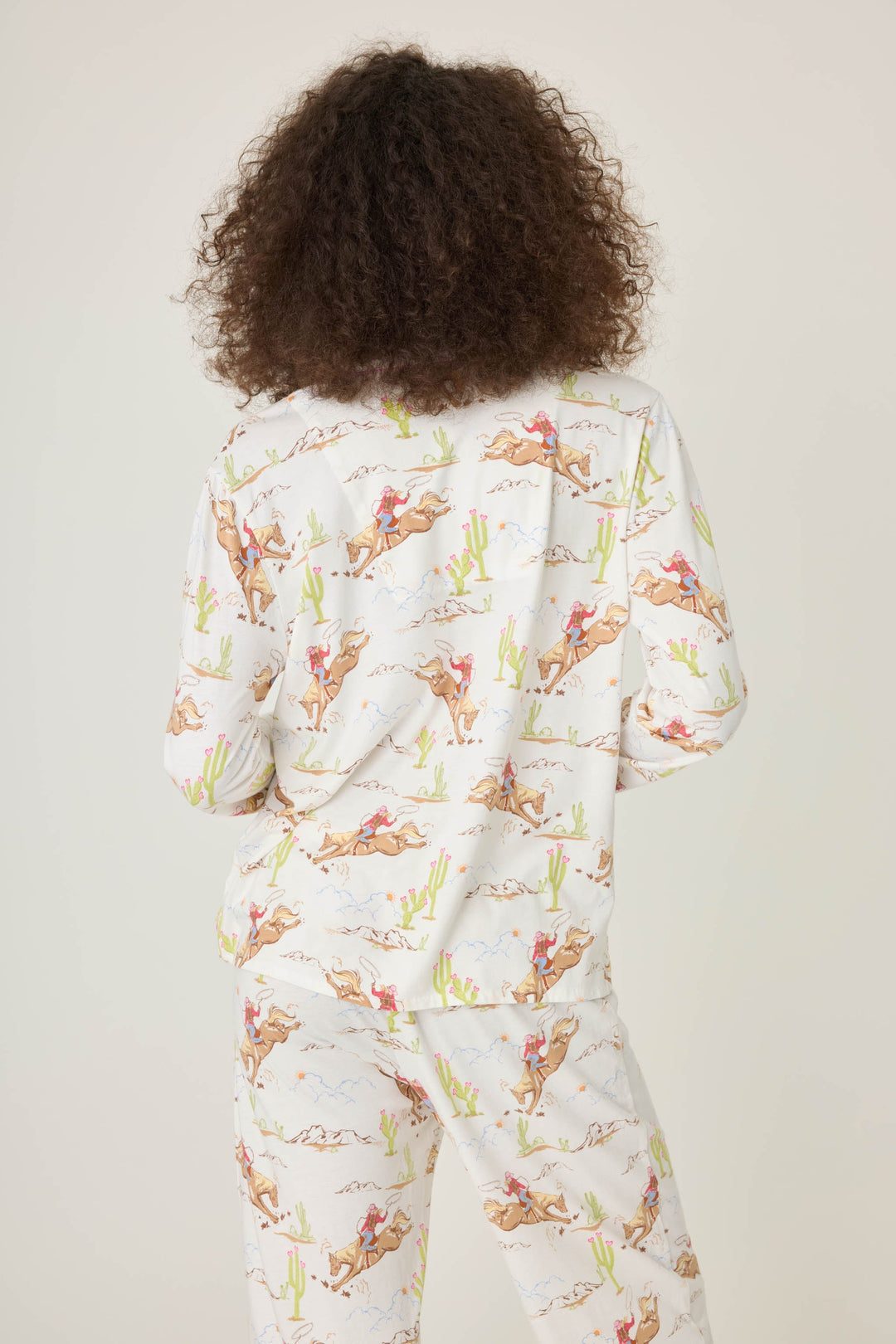 Natural Western print women's pajama top in cotton-blend jersey. Button front with chest pocket.