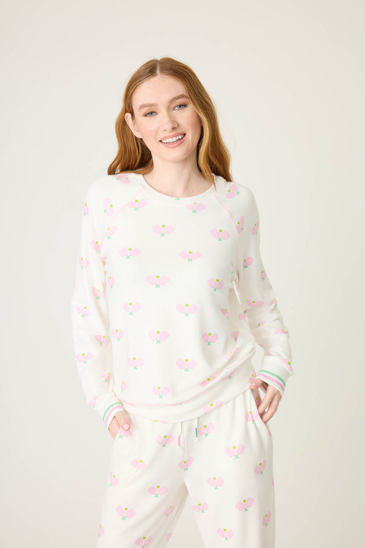 Pickleball racket-printed lounge top for women in ivory-pink. Raglan sleeves & banded hem.