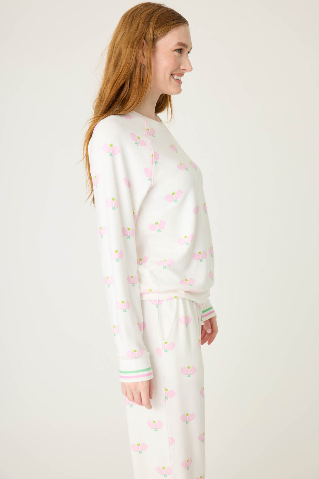 Pickleball racket-printed lounge top for women in ivory-pink. Raglan sleeves & banded hem.