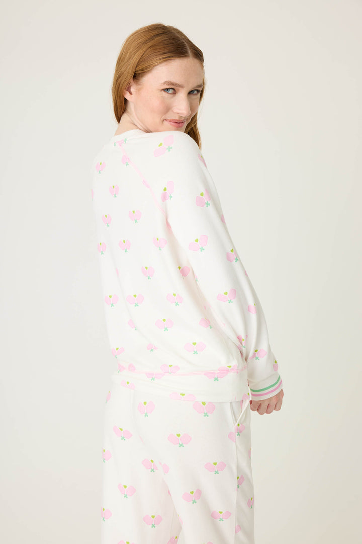 Pickleball racket-printed lounge top for women in ivory-pink. Raglan sleeves & banded hem.