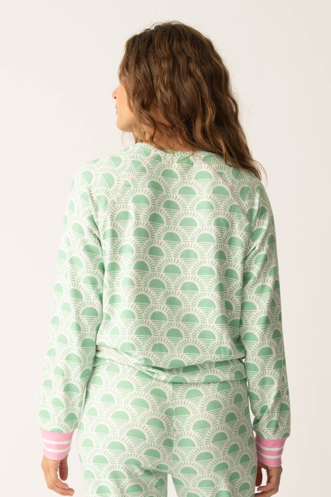 Women's spring racket-sun printed lounge top in ivory-green pattern, with striped pink cuffs.