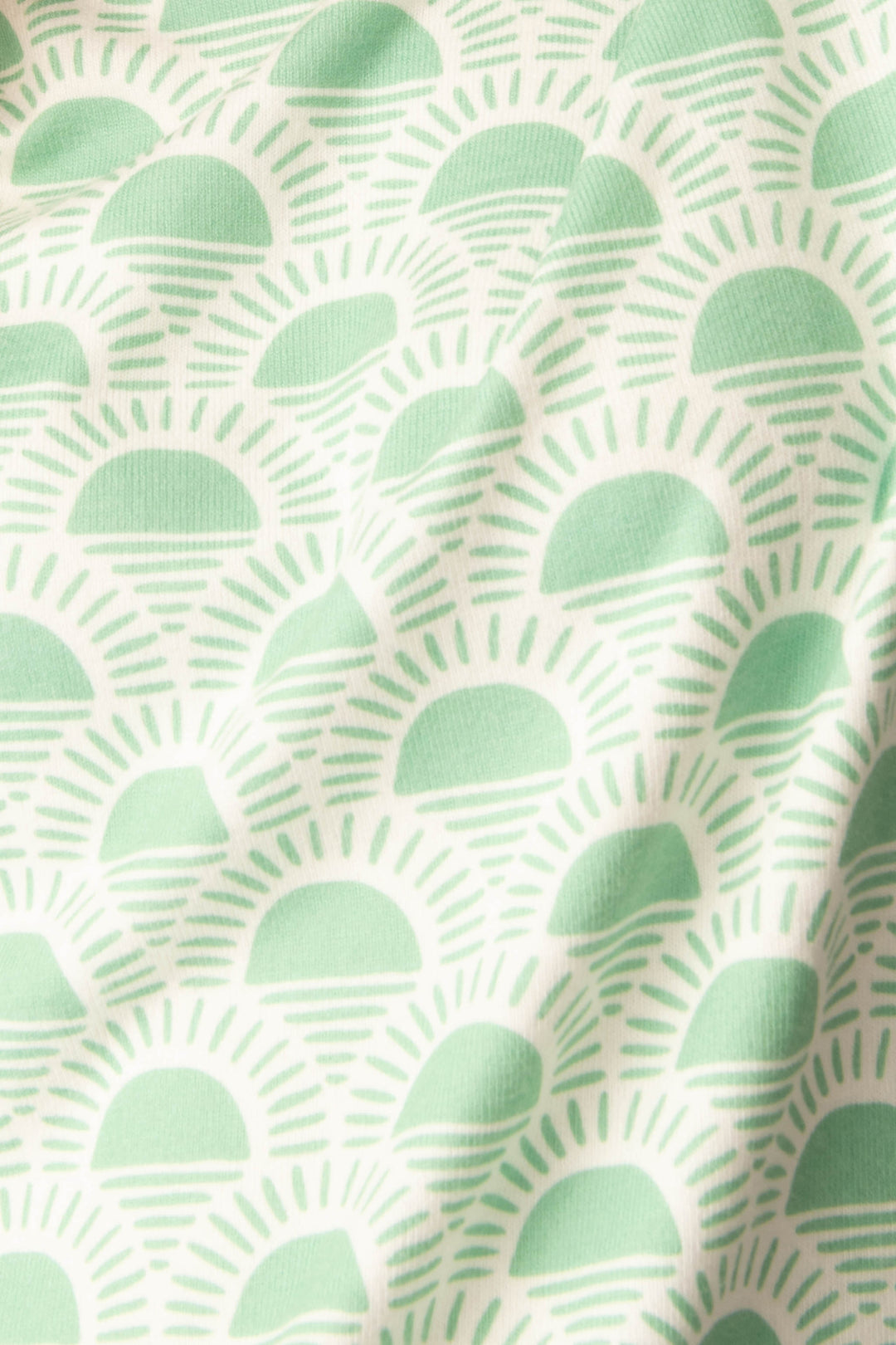 Women's spring racket-sun printed lounge top in ivory-green pattern, with striped pink cuffs.