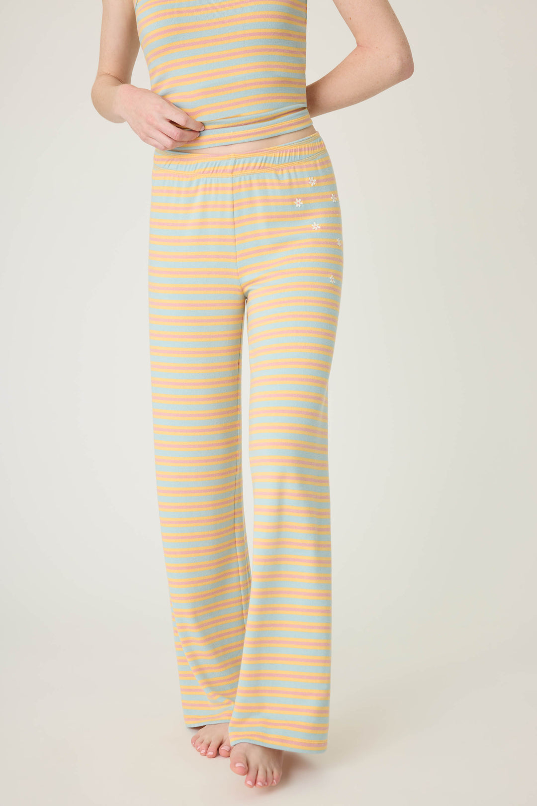 Multi-striped open leg lounge pant in orange-sage-dusty pink. With small floral embroidery details.