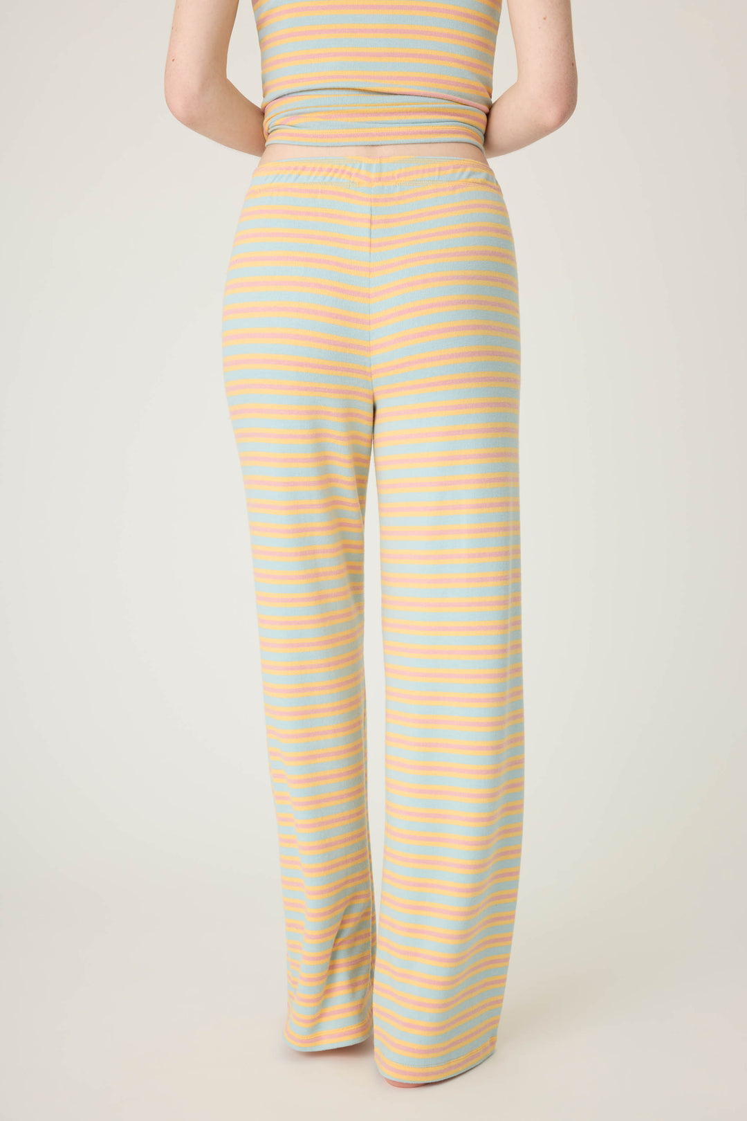 Multi-striped open leg lounge pant in orange-sage-dusty pink. With small floral embroidery details.