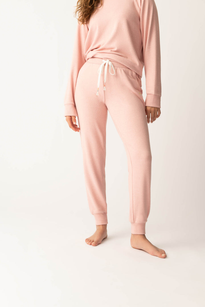 Women's pink melange jogger pant with small heart embroidery on cuff.