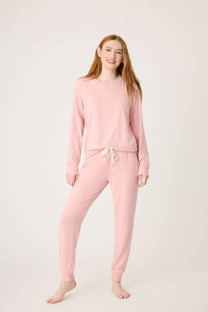 Women's pink melange jogger pant with small heart embroidery on cuff.