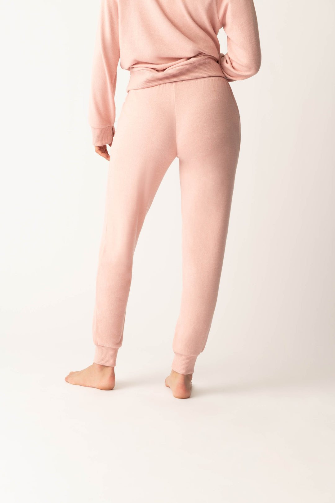 Women's pink melange jogger pant with small heart embroidery on cuff.