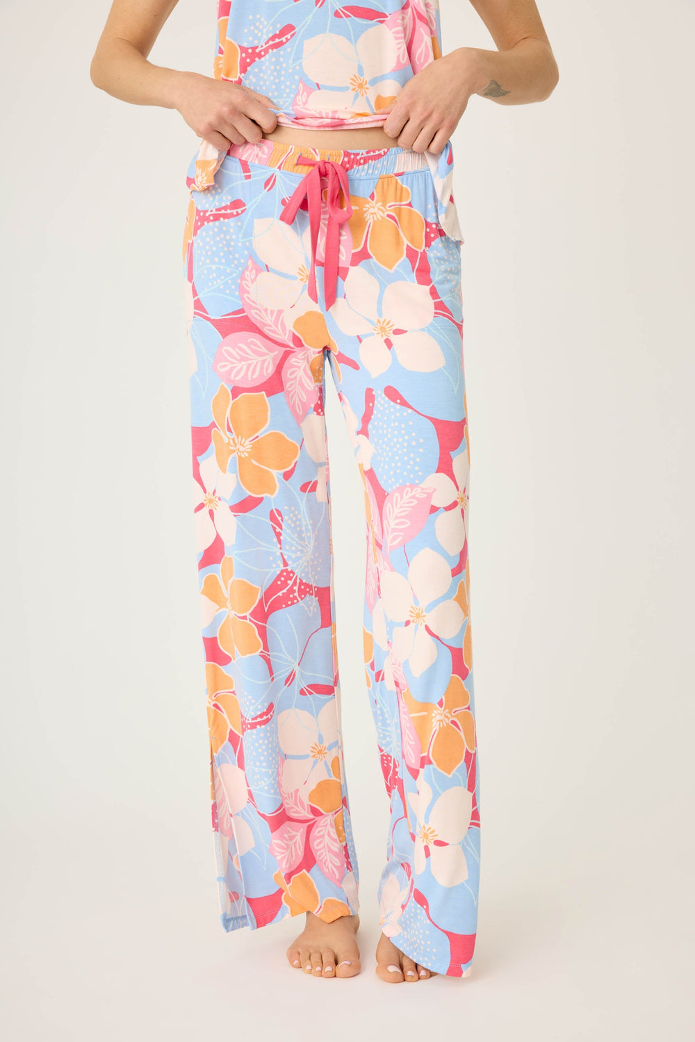 Women's tropical pink & coral floral printed lounge pant in modal jersey. Wide leg with side slits.