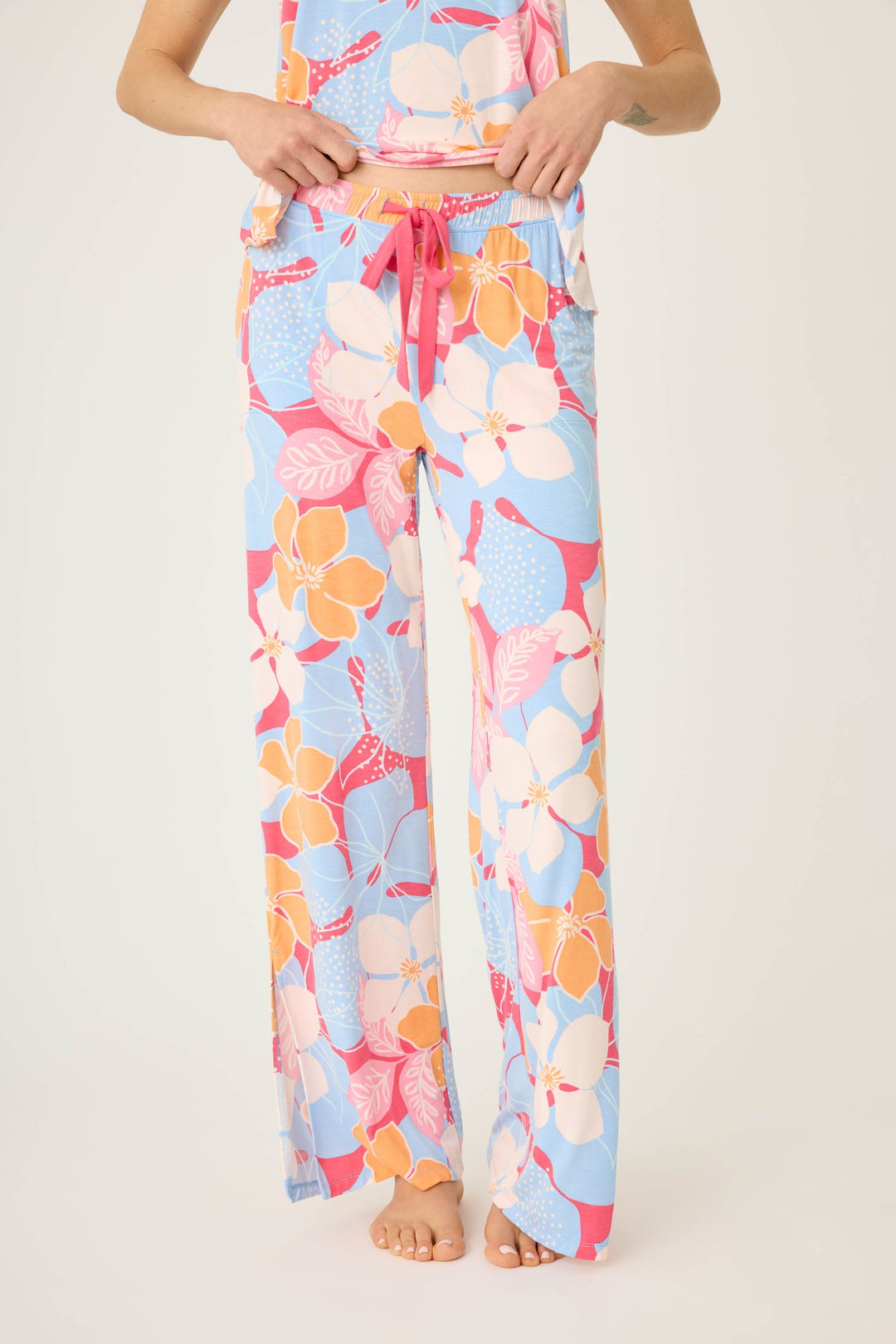 Women's tropical pink & coral floral printed lounge pant in modal jersey. Wide leg with side slits.