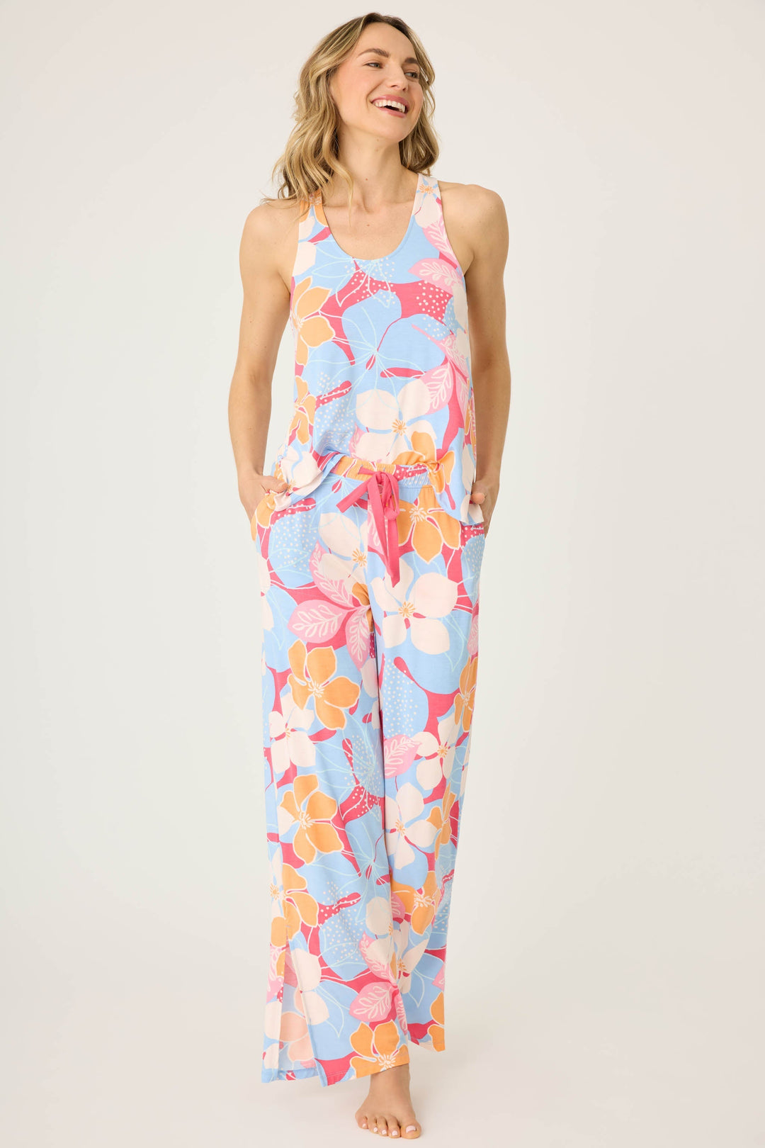 Women's tropical pink & coral floral printed lounge pant in modal jersey. Wide leg with side slits.
