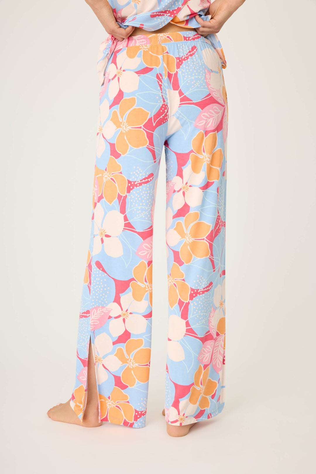 Women's tropical pink & coral floral printed lounge pant in modal jersey. Wide leg with side slits.