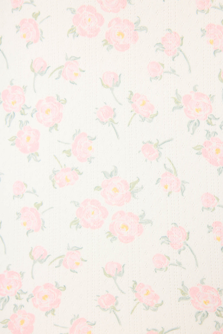 The Ivory Floral Print Henley PJ Set by P.J. Salvage features a soft ivory background with a vintage-inspired pattern of light pink flowers and green leaves, creating a delicate and cozy look.