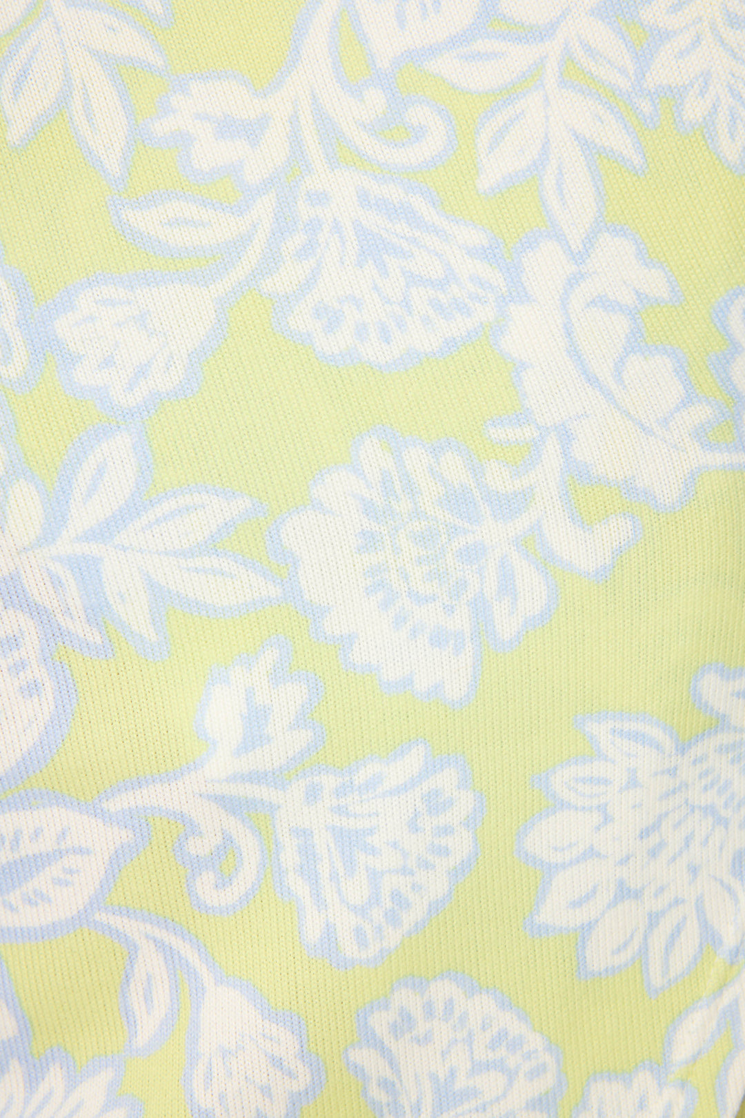 A close-up of the Beautiful Life Floral Print PJ Set by P.J. Salvage, featuring fabric with a pale yellow background, light blue stylized leaves and flowers, and visible textured detail.