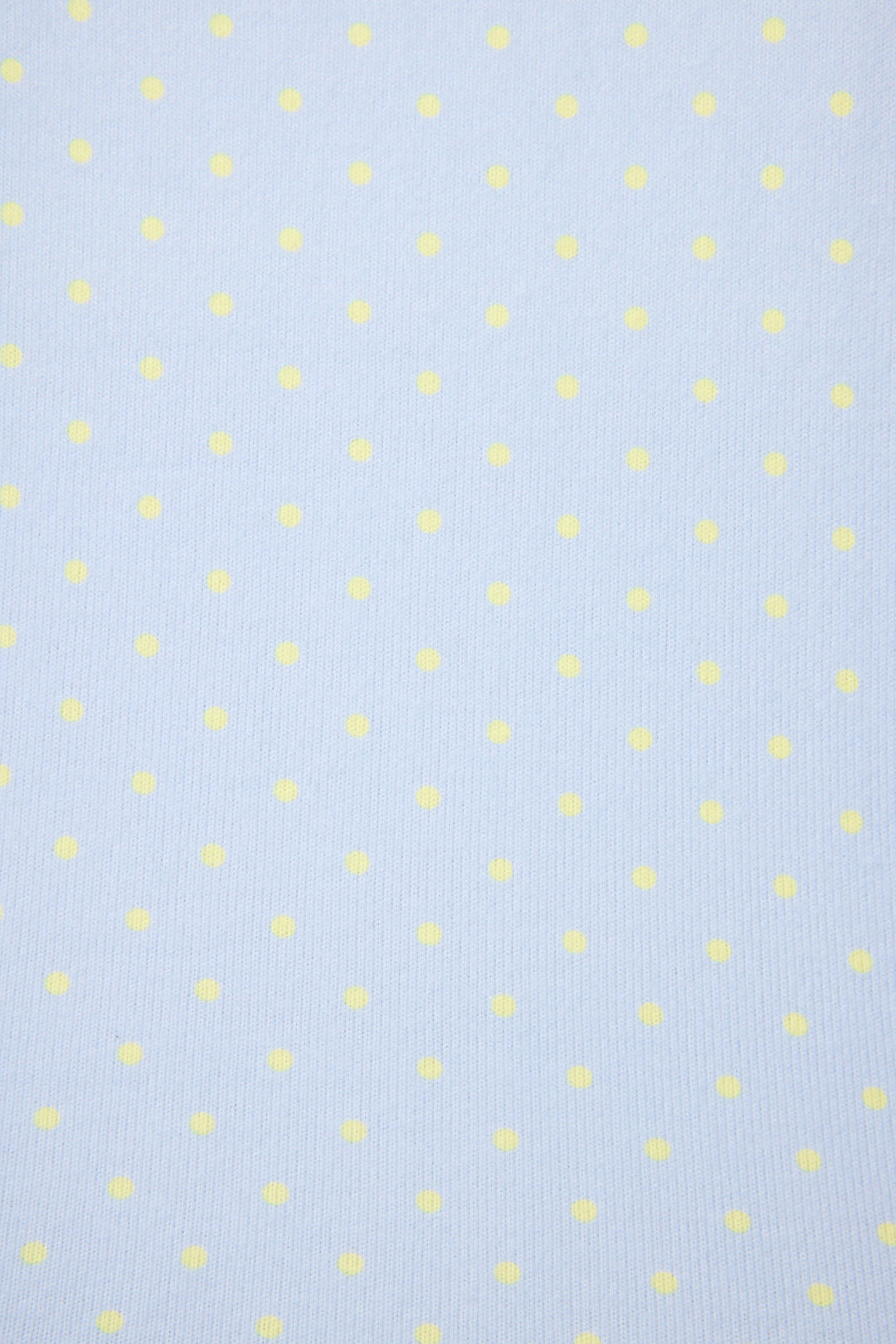 The P.J. Salvage Beautiful Life Polka Dot Pants Set features a light blue background with evenly spaced, small pale yellow polka dots.