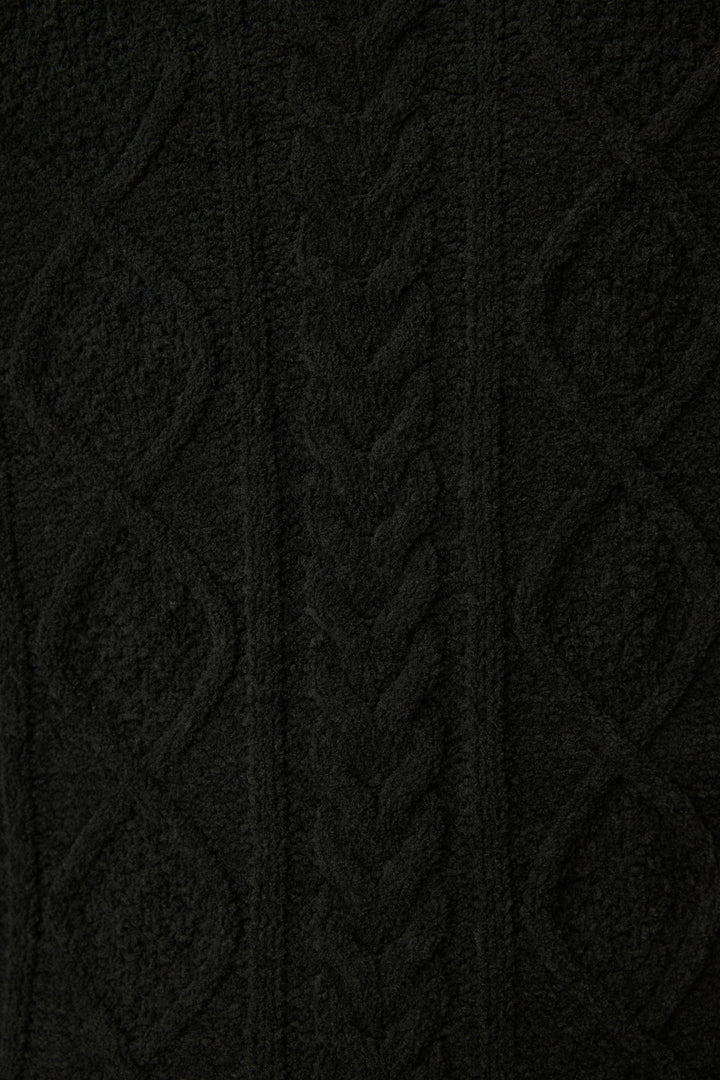 Close-up of the SOLID PJ SET COZY CHENILLE CABLE KNIT by P.J. Salvage, showcasing black cable knit fabric with diamond shapes, braided details, and visible yarn texture.