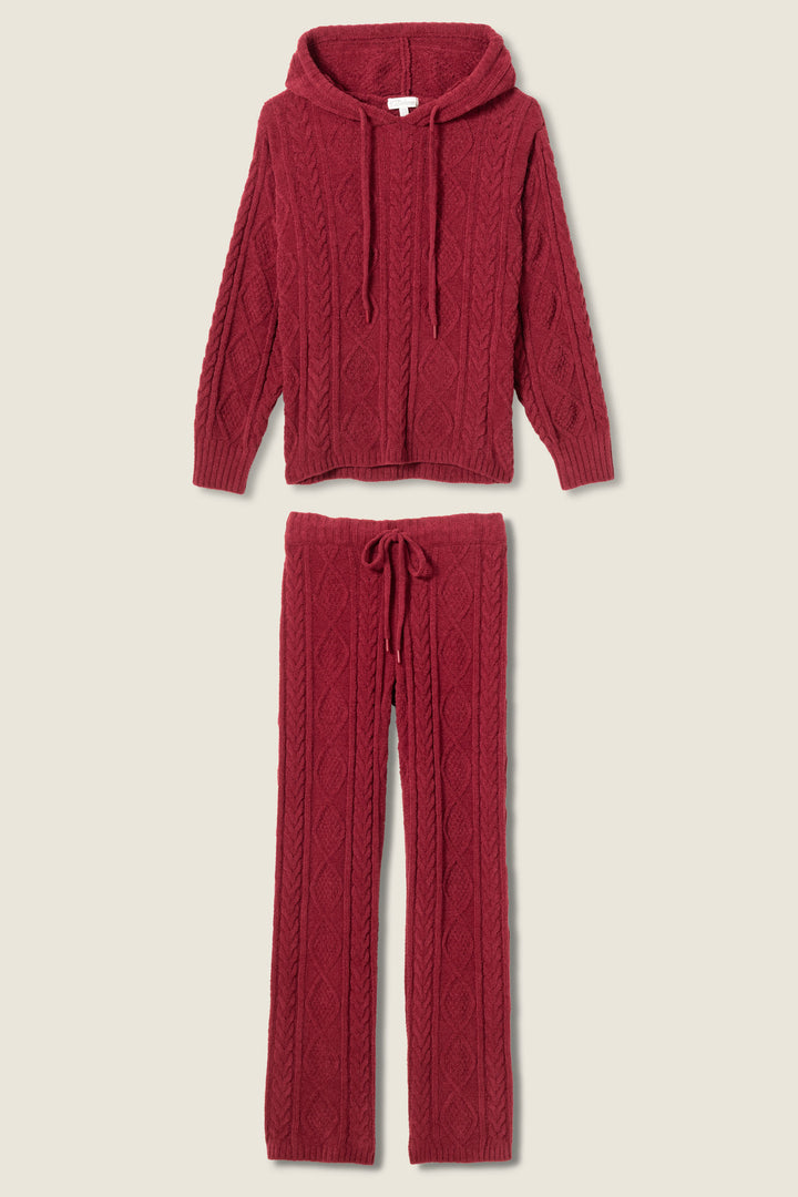 The P.J. Salvage SOLID PJ SET COZY CHENILLE CABLE KNIT is a dark red loungewear set featuring a cable knit hooded sweater with drawstring and matching full-length pants with a drawstring waist.