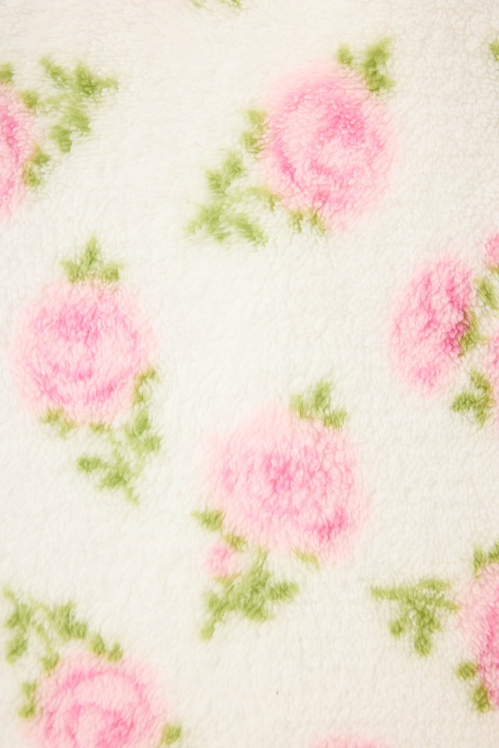 The Lets Get Cozy Floral Print Jacket by P.J. Salvage features soft white fleece adorned with a pattern of pink roses and green leaves.