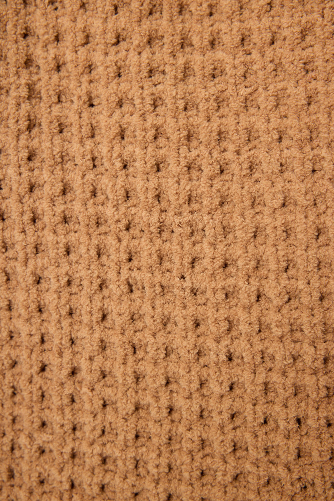 Close-up of the P.J. Salvage Chenille Waffle Caramel Beanie, featuring a textured brown fabric with a waffle pattern and evenly spaced vertical and horizontal ridges.