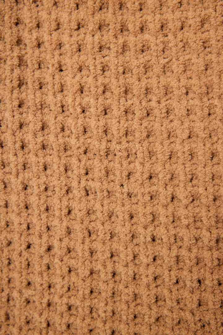 Close-up of the P.J. Salvage Chenille Waffle Caramel Beanie, featuring a textured brown fabric with a waffle pattern and evenly spaced vertical and horizontal ridges.