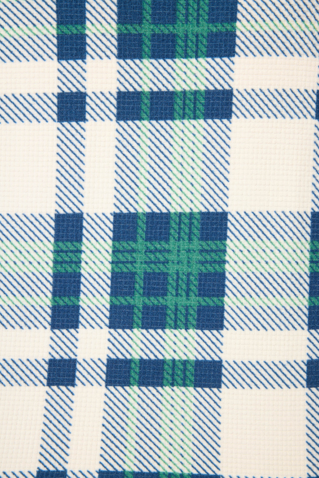 A close-up of the P.J. Salvage Cozy Life Plaid Velour Thermal Short shows its textured fabric with intersecting blue, green, and white lines in a classic grid pattern.
