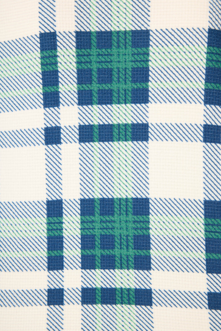 Close-up of the Cozy Life Plaid Velour Thermal PJ Set by P.J. Salvage, featuring soft fabric in a plaid pattern with blue and green lines on a white background. The velour texture is clearly visible.