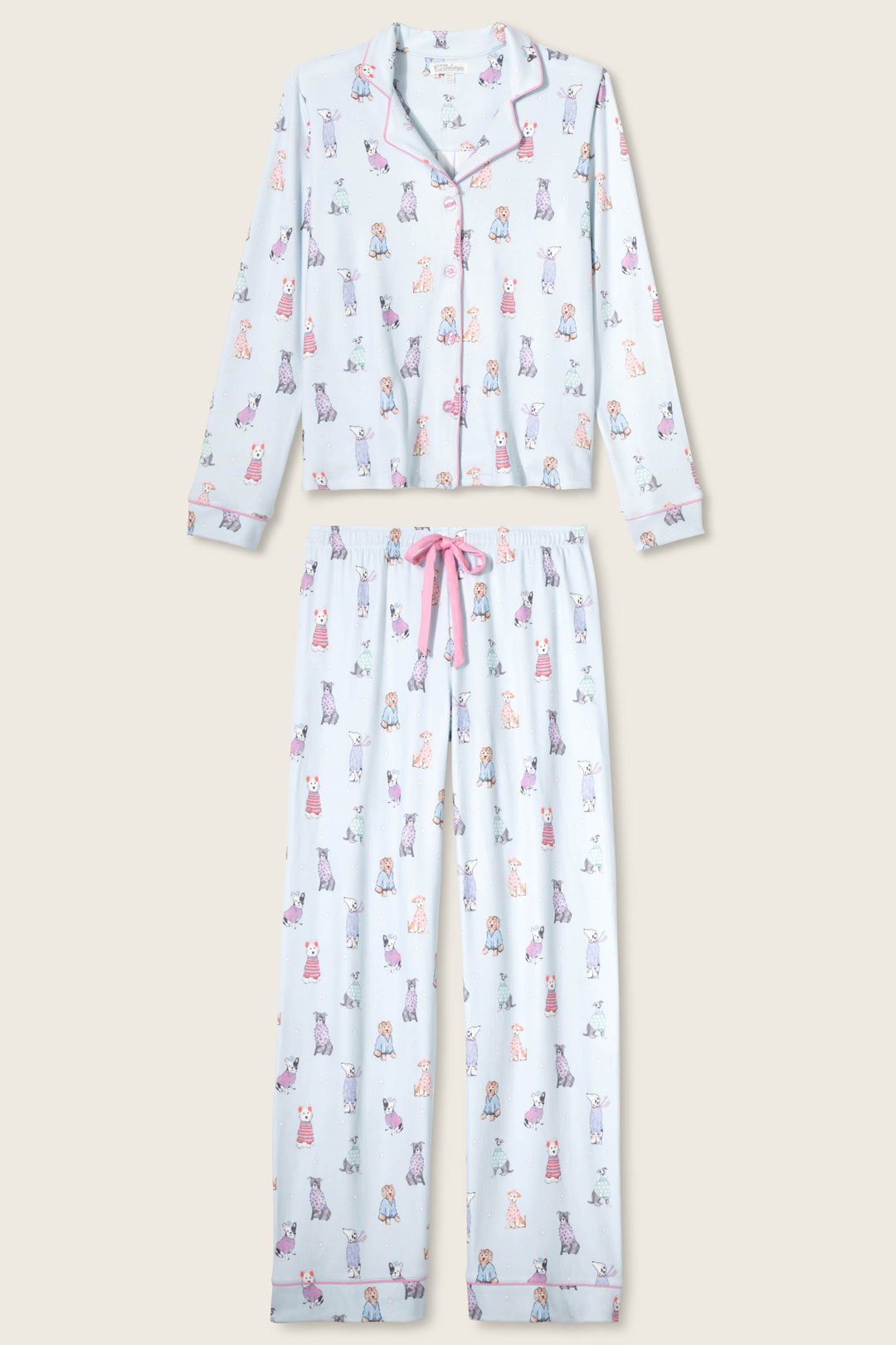 The P.J. Salvage Doggone Cold Dog Print Pointelle PJ Set features long sleeves and pants with a playful dog print, pink piping, and a pink drawstring waist.