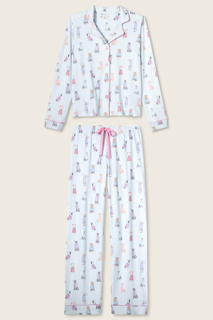 The P.J. Salvage Doggone Cold Dog Print Pointelle PJ Set features long sleeves and pants with a playful dog print, pink piping, and a pink drawstring waist.