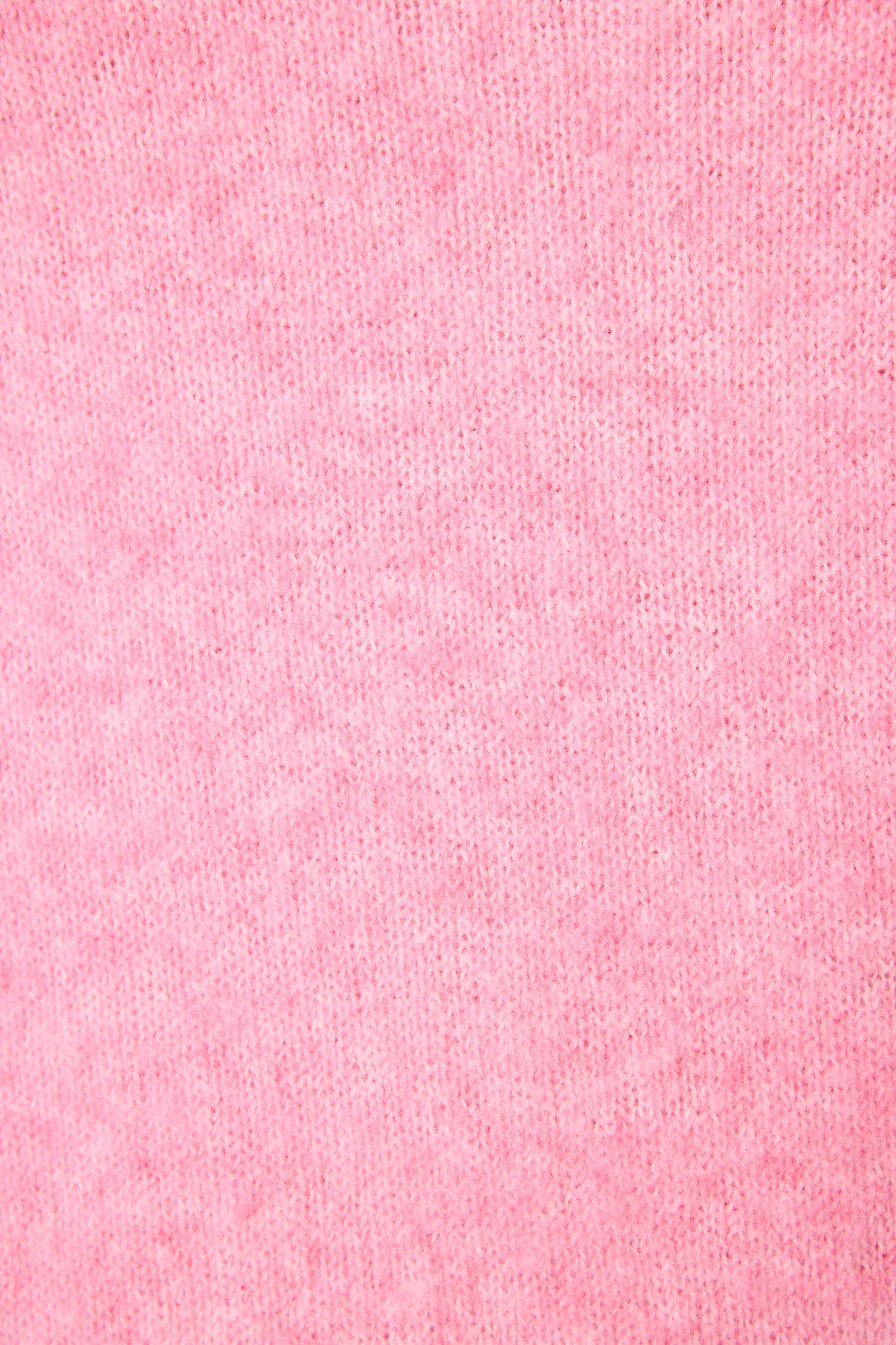 Close-up view of the Cafe Et Croissants Snuggle Sweater by P.J. Salvage, featuring soft, textured pink fabric with visible small fibers and a uniform color pattern.
