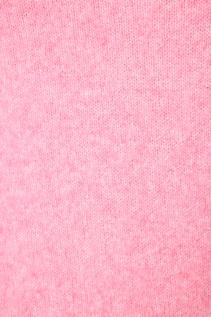 Close-up view of the Cafe Et Croissants Snuggle Sweater by P.J. Salvage, featuring soft, textured pink fabric with visible small fibers and a uniform color pattern.