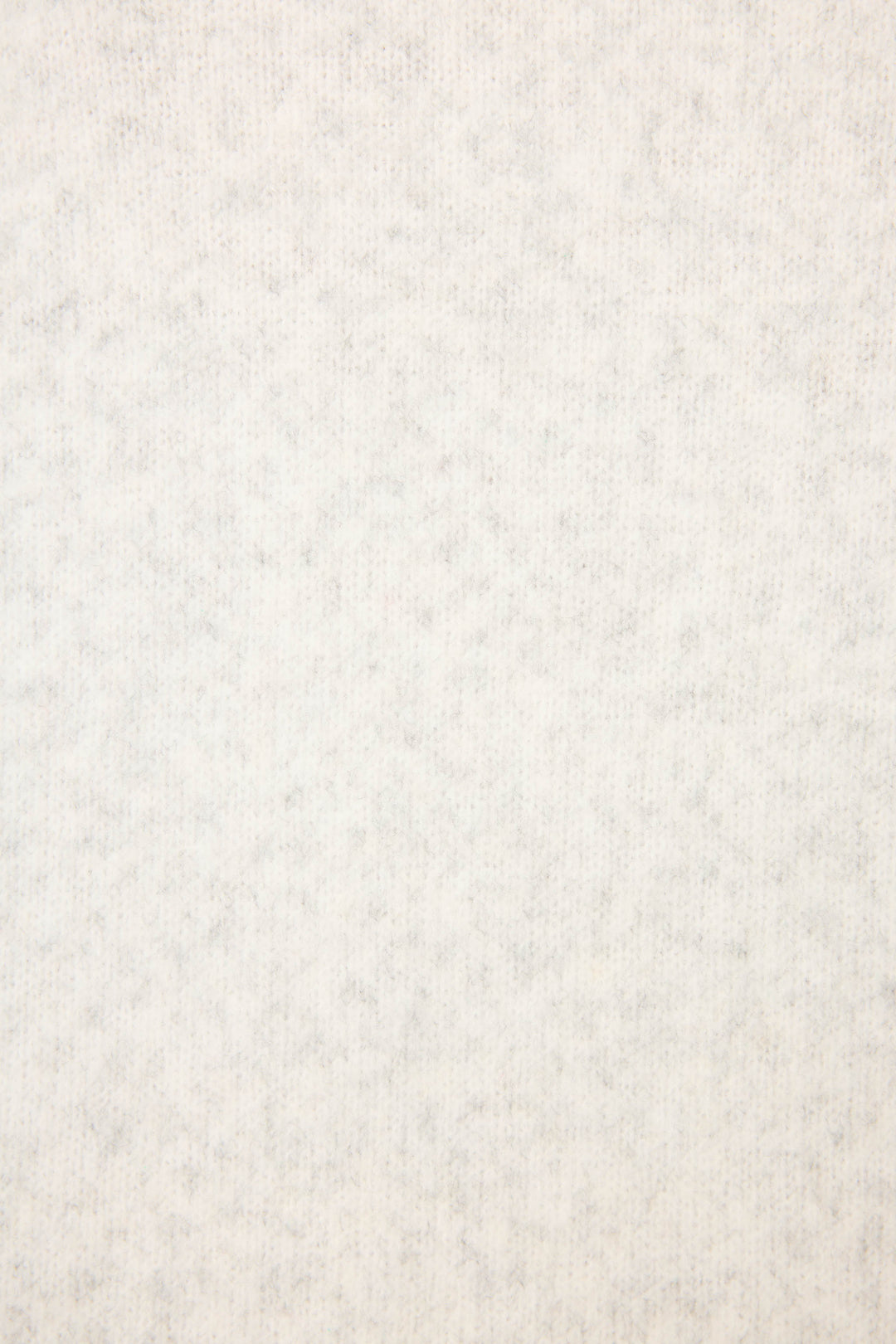 A close-up of the P.J. Salvage Espresso Til Prosecco Snuggle Sweater’s light gray, soft, fuzzy fabric shows its even, plush texture and subtle mottled pattern—perfect for cozy comfort.