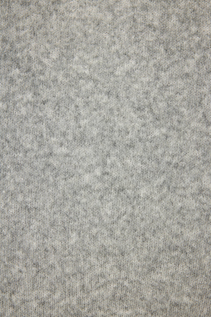 Close-up view of the Snuggle Sweater SLEIGH CREW LONG SLEEVE FLANNELS by P.J. Salvage, featuring light gray heathered knit fabric with a soft, slightly fuzzy texture and subtle mottled pattern.