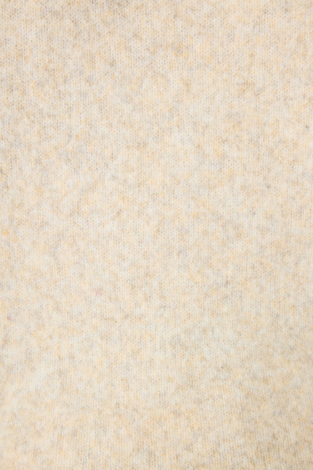Close-up of the Teddy Bear Graphic Snuggle Sweater by P.J. Salvage, showing its soft light beige fabric with a subtle mottled texture and slightly fuzzy appearance, free from distinct patterns or visible objects.