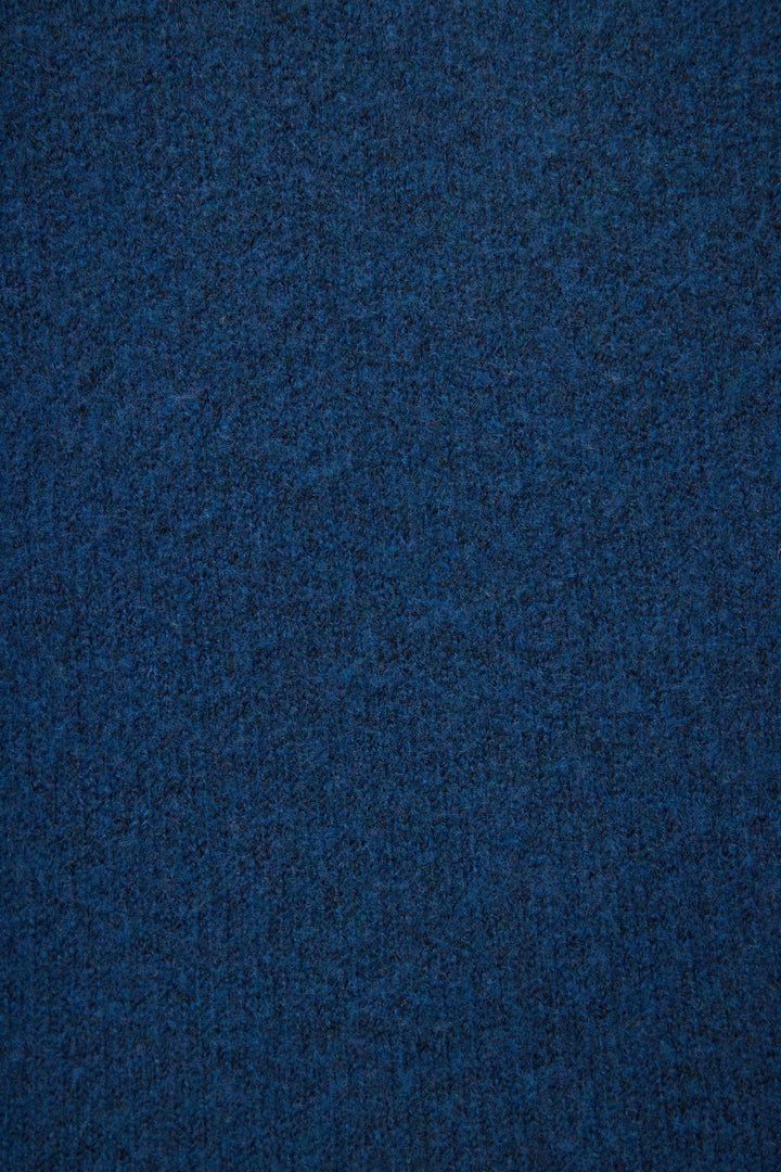 A close-up view of the textured, dark blue Snuggle Sweater SLEIGH CREW LONG SLEEVE FLANNELS by P.J. Salvage.