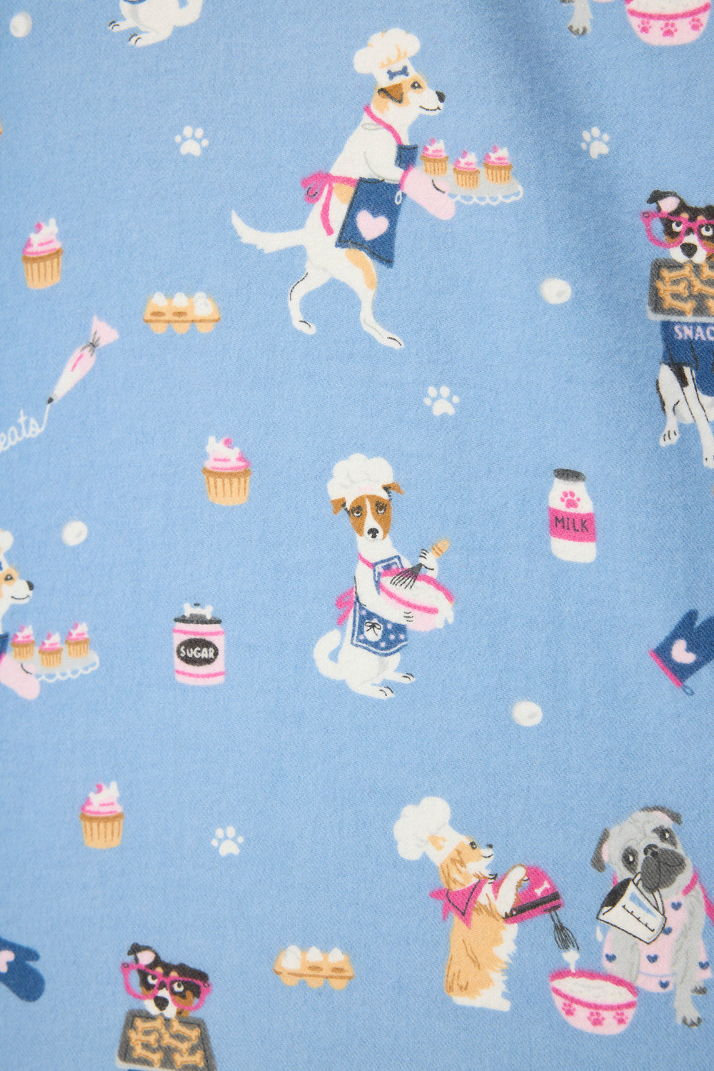 The P.J. Salvage 3-Piece Set WILD PJ SET FLANNELS PLUS features a blue fabric with cartoon dogs dressed as bakers, chef hats and aprons, surrounded by cupcakes, bowls, milk, jars with paw prints, and scattered white paw prints.