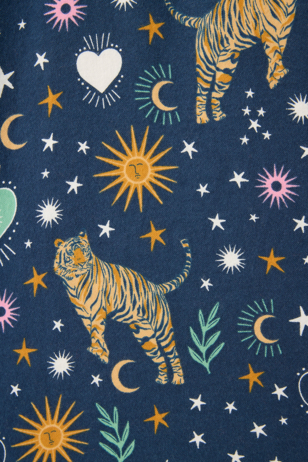 The 3-Piece Set WILD PJ SET FLANNELS PLUS by P.J. Salvage features a dark blue background with tigers, crescent moons, stars, suns with faces, hearts, and green leaves in orange, white, yellow, green, and pink colors.