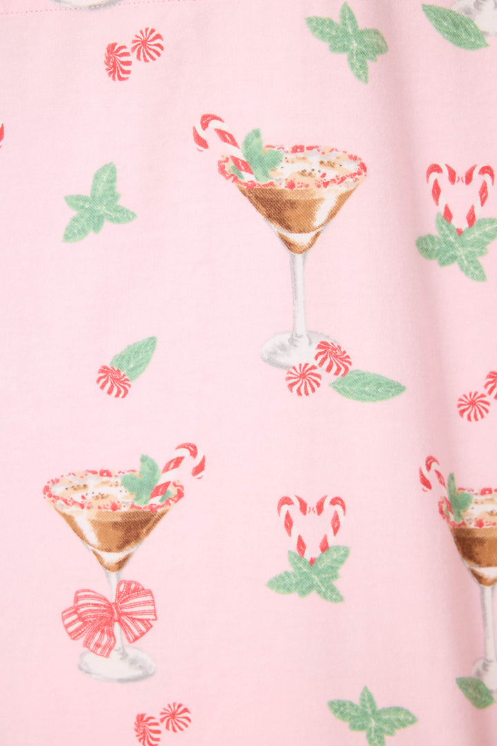 The Tini Time Drink Print Flannel PJ Set by P.J. Salvage features pink fabric with martini glasses filled with desserts, mint leaves, candy canes, and scattered peppermint candies and green mint leaf illustrations.