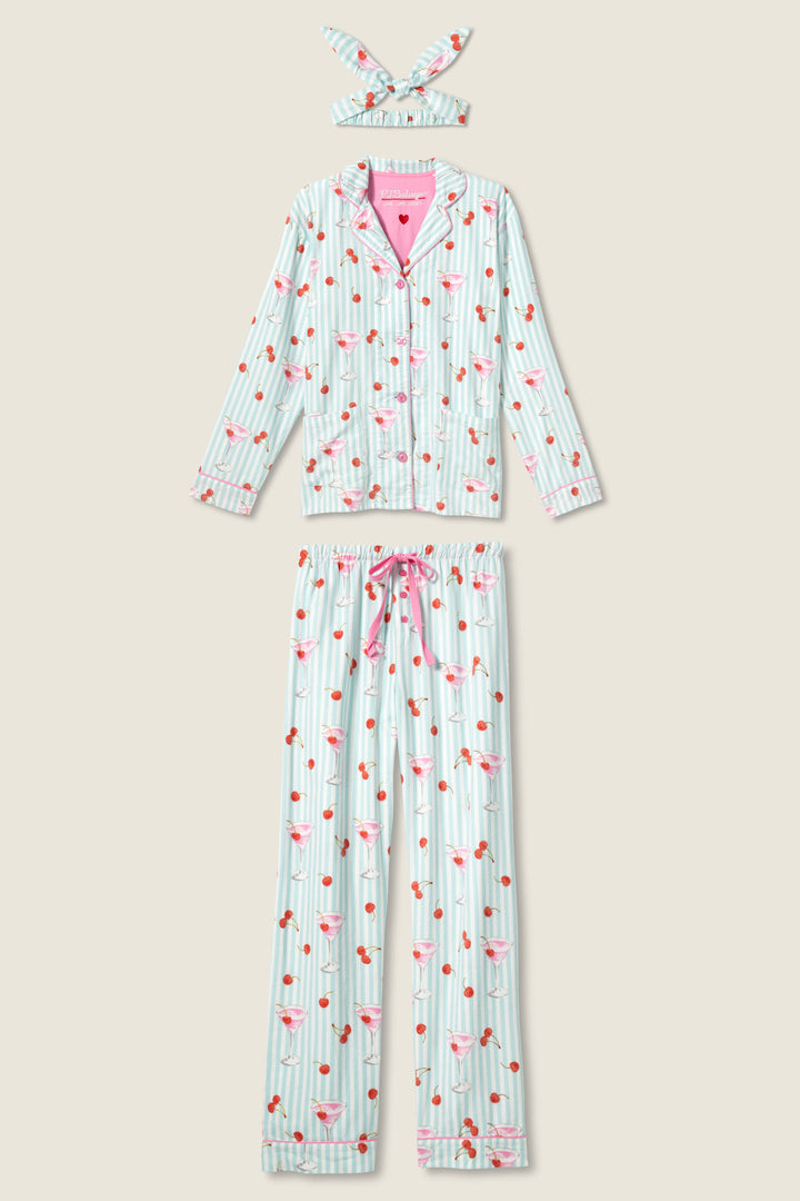The P.J. Salvage 3-Piece Set PAISLEY PJ SET FLANNELS includes a long-sleeve button-up top, long pants with a pink drawstring, and a matching headband, all featuring blue and white stripes with pink flamingos and cherry prints.