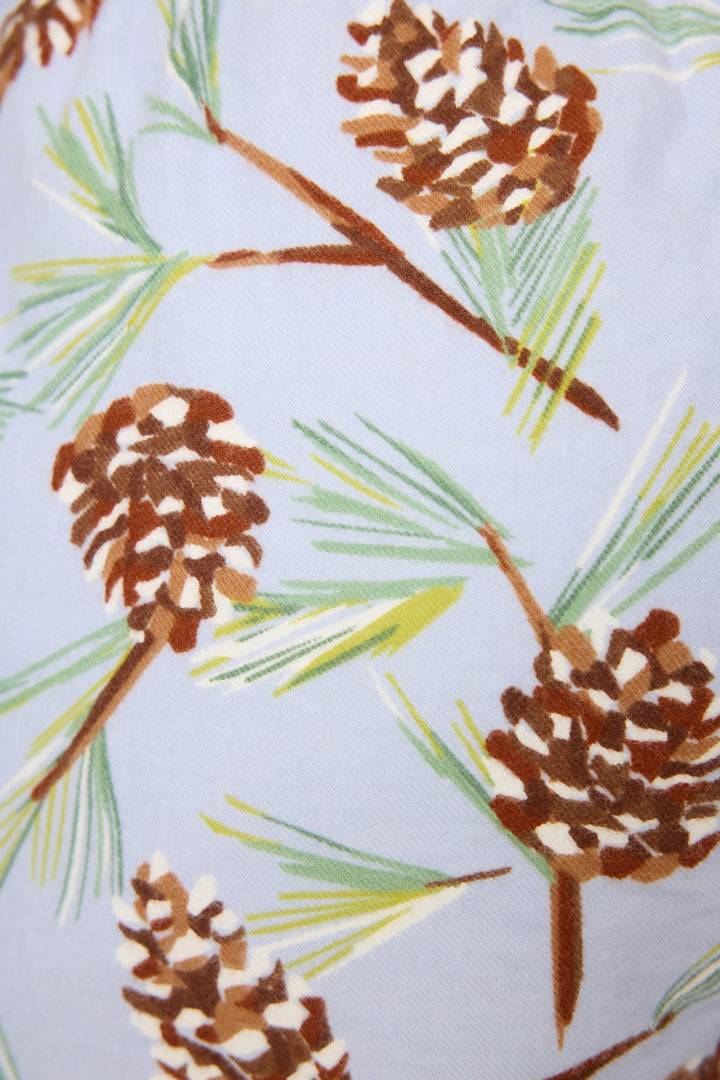 The Feelin' Pine Winter Print Flannel Shorts by P.J. Salvage feature soft cotton twill flannel with brown pine cones and green needles on light blue—perfect for relaxed-fit blue flannel boxer shorts.