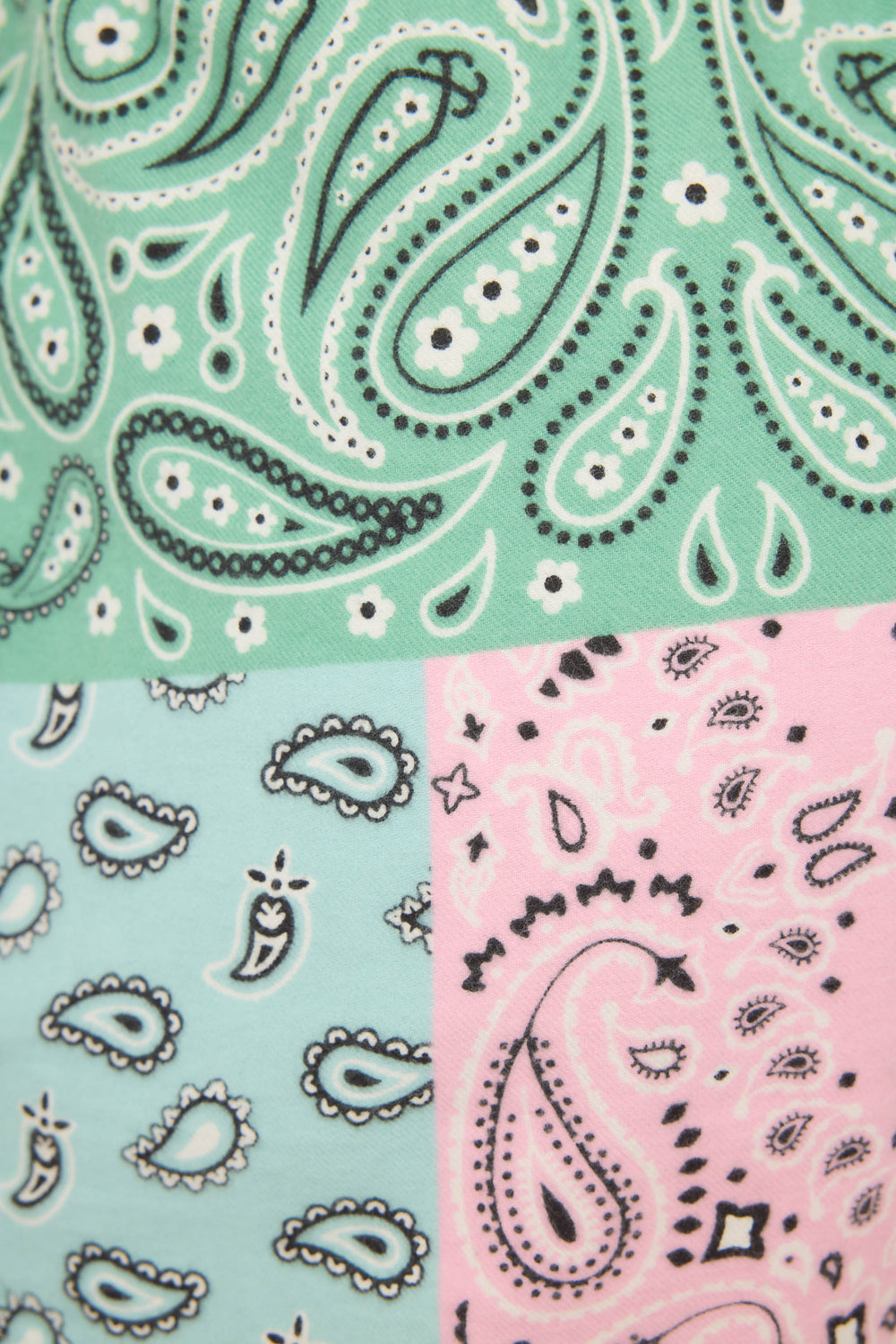 A close-up of P.J. Salvages Howdy Honey Paisley Print Flannel Shorts shows a patchwork design in green, light blue, and pink, each section featuring classic black and white paisley patterns.