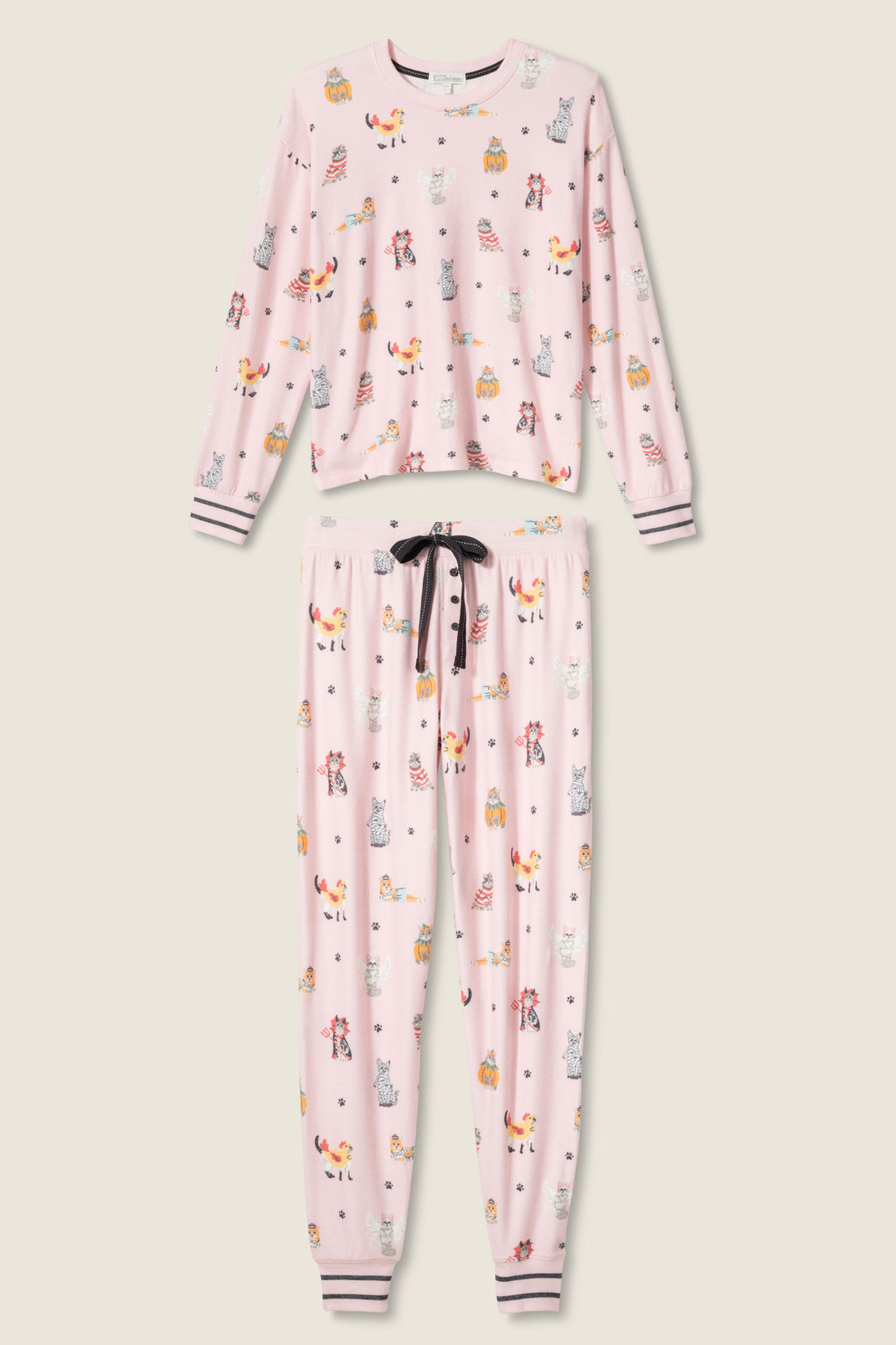 The P.J. Salvage CATS PJ SET FELINE SPOOKY is a pink pajama set with a long-sleeve top and pants, featuring playful animal and object prints, striped white/pink/black cuffs, and a black drawstring on the pants.